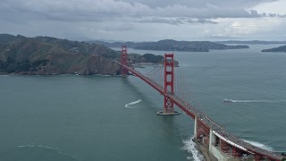 AX0173_0052 - 6K aerial stock footage flying through fog to reveal the Golden Gate Bridge in San Francisco, California