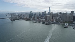 AX0173_0069 - 6K aerial stock footage of flying away from skyscrapers in Downtown San Francisco, California