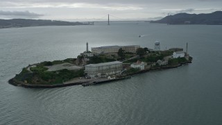 AX0173_0084 - 6K stock footage aerial video of orbiting the historic Alcatraz prison, San Francisco, California
