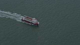 AX0173_0089 - 6K aerial stock footage of a ferry sailing on San Francisco Bay, California