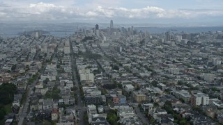 AX0173_0094 - 6K aerial stock footage fly through fog to reveal the San Francisco skyline, California