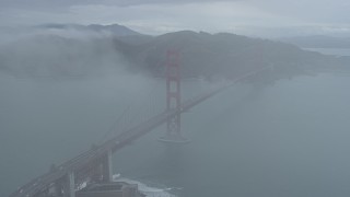 AX0173_0097 - 6K stock footage aerial video flyby fog and the Golden Gate Bridge, California