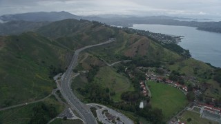 AX0173_0101 - 6K aerial stock footage flyby 101 to the tunnel and reveal Sausalito, California