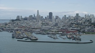 AX0173_0103 - 6K stock footage aerial video of the San Francisco skyline seen from Fisherman's Wharf, California