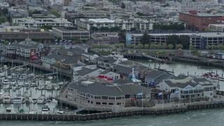 AX0173_0105 - 6K aerial stock footage of flying by Pier 39 in San Francisco, California