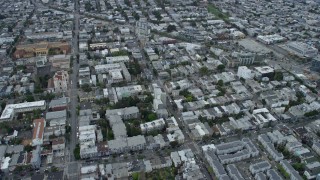 AX0173_0114 - 6K aerial stock footage of apartment buildings in the Mission District, San Francisco, California