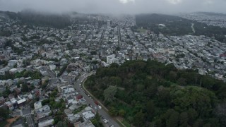 AX0173_0116 - 6K stock footage aerial video fly over the Castro District and park for view of Cole Valley, San Francisco, California