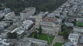 AX0173_0120 - 6K aerial stock footage orbit St. Ignatius Church in the Inner Richmond District, San Francisco, California