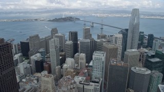 AX0173_0125 - 6K stock footage aerial video fly over Downtown San Francisco toward Yerba Buena Island and Bay Bridge, California