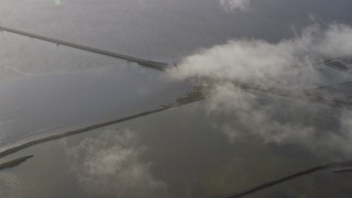 AX0174_0008 - 6K aerial stock footage of flying away from the San Mateo Bridge, Hayward, California