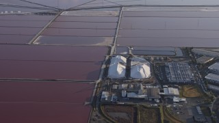 AX0174_0014 - 6K aerial stock footage of flying by mounds of salt and marshes, Newark, California