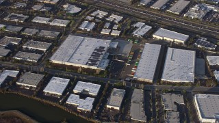AX0174_0018 - 6K aerial stock footage of Fremont warehouse buildings, California