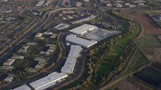 AX0174_0019 - 6K aerial stock footage of Milpitas warehouse buildings, California