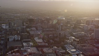 AX0174_0023 - 6K aerial stock footage of flying by Downtown San Jose at sunset, California
