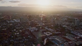AX0174_0024 - 6K aerial stock footage of passing by Downtown San Jose at sunset, California