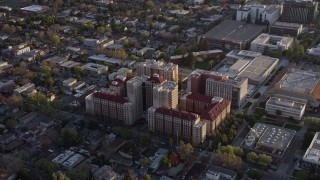 AX0174_0028 - 6K aerial stock footage of student housing at San Jose State University at sunset, California