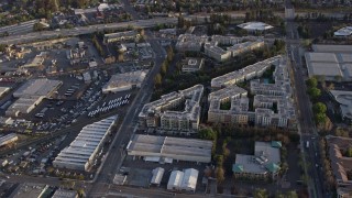 AX0174_0033 - 6K aerial stock footage of San Jose apartment complexes at sunset, California