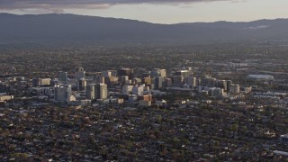 AX0174_0041 - 6K stock footage aerial video of a wide view of city buildings in Downtown San Jose at sunset, California