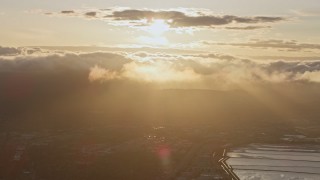 AX0174_0052 - 6K aerial stock footage of clouds at sunset over Menlo Park, California