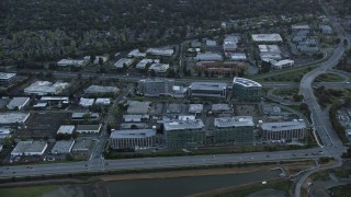 AX0174_0054 - 6K stock footage aerial video of Facebook office buildings at sunset, Menlo Park, California