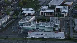 AX0174_0055 - 6K aerial stock footage of the Stanford Medicine Outpatient Center at sunset, Redwood City, California