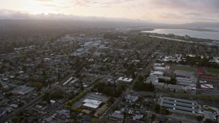 AX0174_0063 - 6K aerial stock footage of flying over San Mateo residential neighborhoods at sunset, California