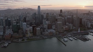 AX0174_0083 - 6K aerial stock footage of passing by Downtown San Francisco at sunset, California
