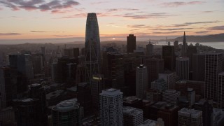 AX0174_0092 - 6K stock footage aerial video of flying over Downtown San Francisco toward the setting sun, California