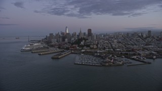 AX0174_0096 - 6K aerial stock footage of towering skyscrapers in the Downtown San Francisco skyline at twilight, California