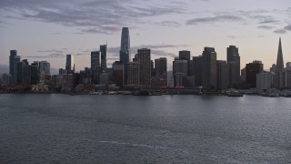 AX0174_0099 - 6K aerial stock footage of approaching the Downtown San Francisco skyline at twilight, California