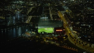 AX0174_0140 - 6K aerial stock footage of Oracle Park stadium at night, San Francisco, California