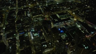 AX0174_0149 - 6K aerial stock footage of office buildings and Moscone Center at night in Downtown San Francisco, California
