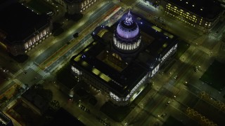 AX0174_0150 - 6K aerial stock footage of San Francisco City Hall at night, California