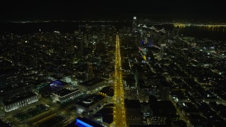 AX0174_0151 - 6K aerial stock footage follow Market Street toward Downtown San Francisco at night, California