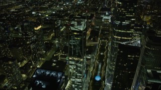 AX0174_0164 - 6K stock footage aerial video of flying past a skyscraper in Downtown San Francisco at night, California