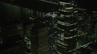 AX0174_0165 - 6K aerial stock footage of Millennium Tower and Salesforce Tower in Downtown San Francisco at night, California