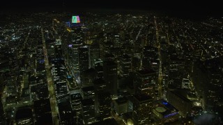 AX0174_0168 - 6K aerial stock footage of Salesforce Tower and skyscrapers in Downtown San Francisco at night, California