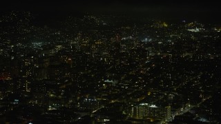 AX0174_0169 - 6K aerial stock footage of Nob Hill apartment and office buildings at night, San Francisco, California