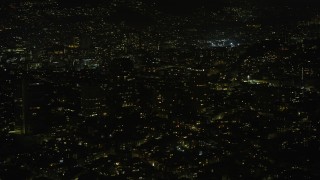 AX0174_0170 - 6K aerial stock footage of passing Nob Hill apartment and office buildings at night, San Francisco, California