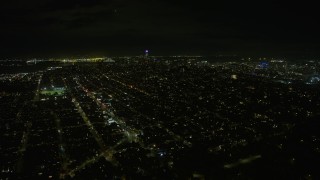 AX0174_0174 - 6K aerial stock footage of Downtown San Francisco seen from Marina District at night, California