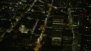 AX0174_0186 - 6K stock footage aerial video flyby skyscrapers to reveal Grant Ave through Chinatown at night, San Francisco, California