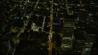 AX0174_0187 - 6K aerial stock footage tilt to bird's eye view of Grant Ave in Chinatown at night, San Francisco, California