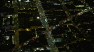 AX0174_0191 - 6K aerial stock footage the intersection of Columbus Avenue and Broadway at night, North Beach, San Francisco, California