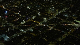 AX0174_0192 - 6K aerial stock footage orbit the intersection of Columbus Avenue and Broadway at night, North Beach, San Francisco, California