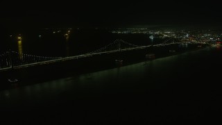 AX0174_0195 - 6K aerial stock footage pan to the Bay Bridge at night, San Francisco, California