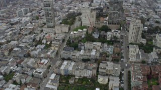 AX0175_0009 - 6K aerial stock footage of Russian Hill apartment buildings in San Francisco on a foggy day, California