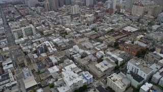 AX0175_0010 - 6K aerial stock footage of Nob Hill city and apartment buildings in San Francisco on a foggy day, California