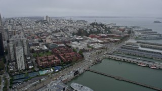 AX0175_0022 - 6K aerial stock footage flyby Downtown San Francisco and Coit Tower on a foggy day, California