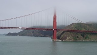 AX0175_0030 - 6K aerial stock footage of the Marin side of the Golden Gate Bridge on a foggy day, San Francisco, California