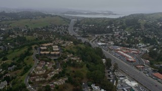 AX0175_0039 - 6K stock footage aerial video of Highway 101 through Mill Valley on a foggy day, California
